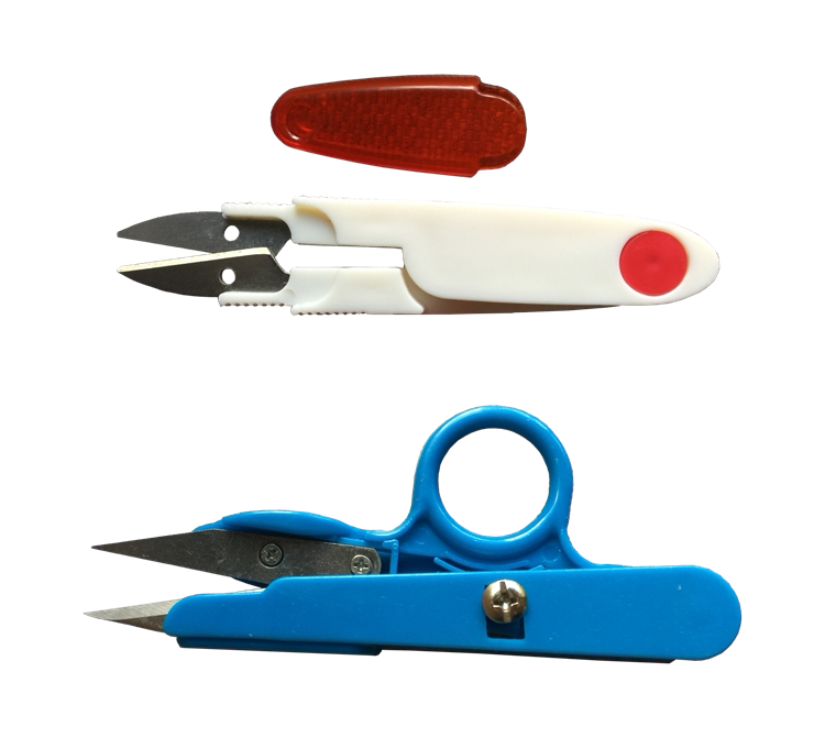 Cut of the cut of the rubberized fabric by the small scissors