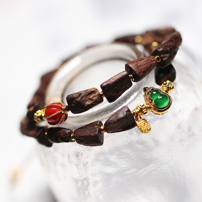 Dalagan with the shape of 99 points agarwood bracelet with emerald organic ruby ​​inlaid with 18K gold and 24K gold accessories