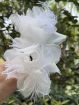 Megos original fairy-like handmade flower and feather bridal headwear and makeup styling for photoshoots and travel location samples