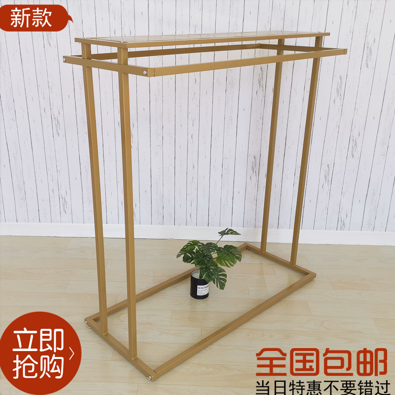 Clothing store display frame floor girls clothing store special display shelves clothes rack gold hanging on the side of the side