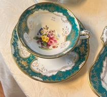 Dark green hand-painted cups and saucers one cup and one saucer diameter 12 cup 10 height 6