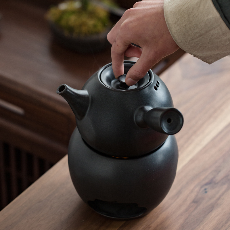 Japanese charcoal'm black pottery teapot zen side put the pot of boiled tea, the electric TaoLu who mandarin orange, white tea pu 'er large base