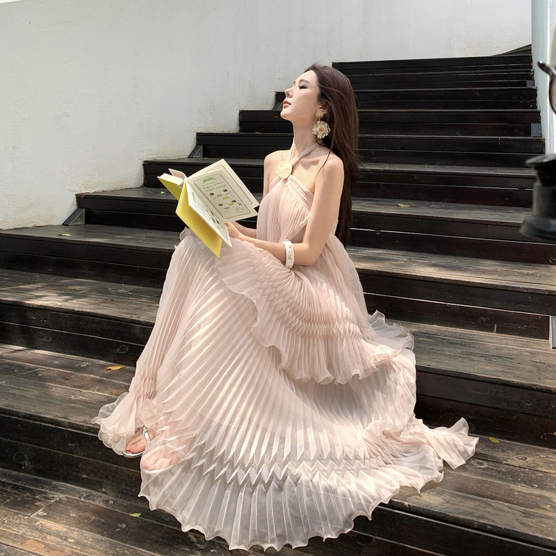 Beautiful and Ethereal Nude Pink Pleated Halter Neck Dress for Women, Perfect for Summer Beach Vacations, with a Large, Flowing Skirt