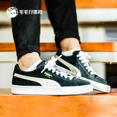 puma suede black white on feet