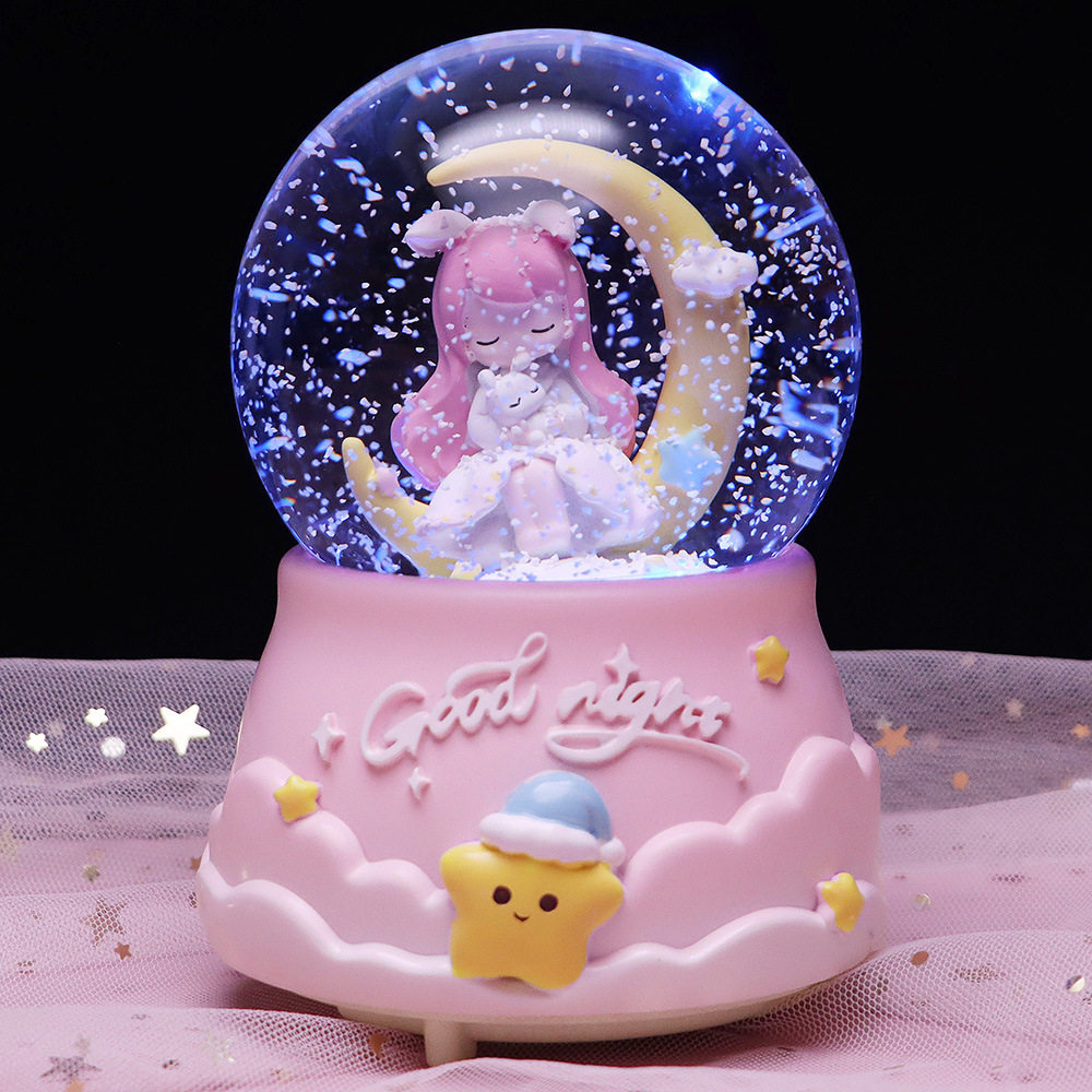 雪の結晶効果のある回転式光るクリスタルボールオルゴール。子供向けの飾り物、女の子やガールフレンドへの誕生日プレゼント。