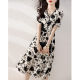 High-end printed dress women's summer new French V-neck waist slimming temperament elegant light familiar style a-line skirt