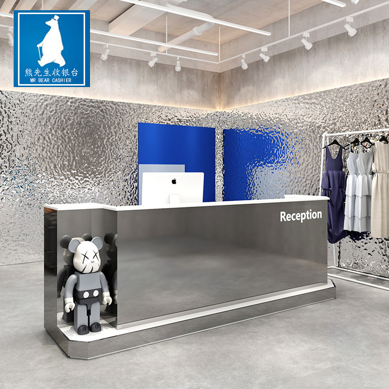 Minimalist modern clothing store Richie shop collections silver counter beauty salon company Reception front desk profiled stainless steel bar