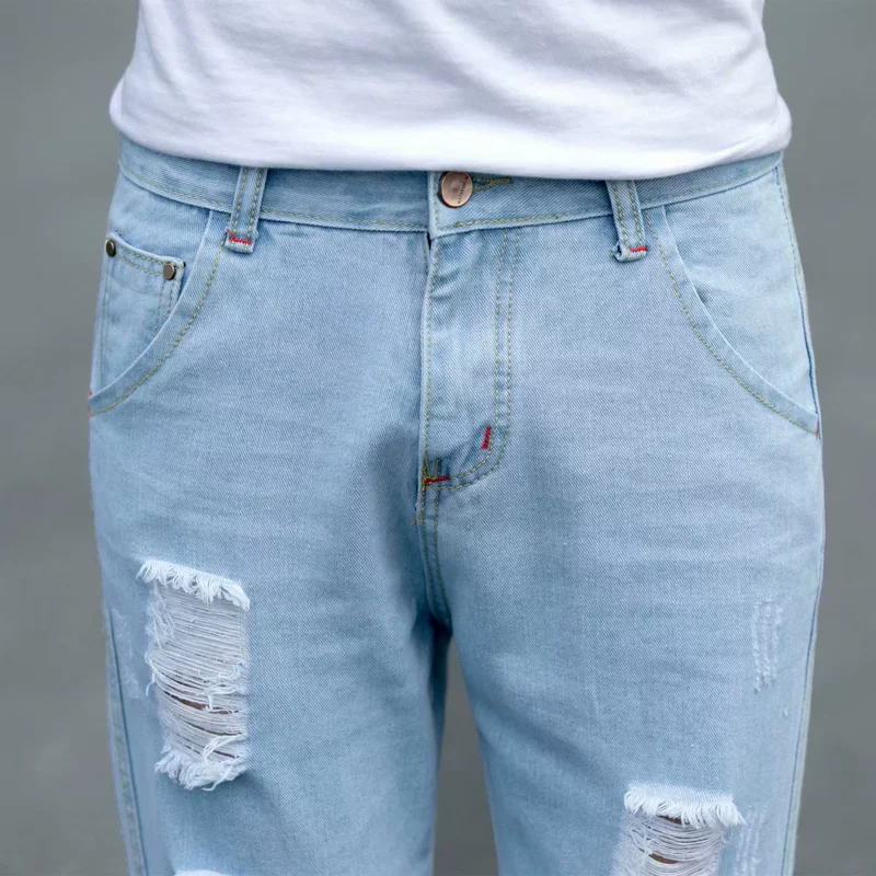 Mùa xuân và mùa thu lỗ quần jeans nam chân mỏng cắt quần màu xanh nhạt xu hướng ăn xin quần quần nam triều Hàn - Quần jean