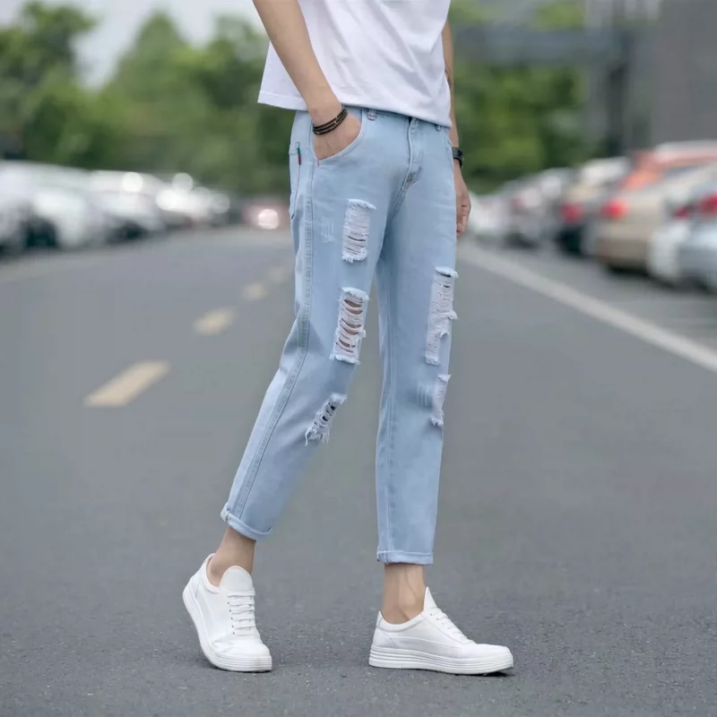 Mùa xuân và mùa thu lỗ quần jeans nam chân mỏng cắt quần màu xanh nhạt xu hướng ăn xin quần quần nam triều Hàn - Quần jean