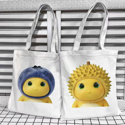 Fruit milk dragon cartoon canvas bag for students, high appearance level, cute ins expression, single-shoulder hand-carry schoolbag for commuting