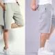 [Mua một tặng một] quần short nam mùa hè năm quần cộng với phân bón XL thể thao đi biển quần rộng béo jogger nam