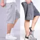 [Mua một tặng một] quần short nam mùa hè năm quần cộng với phân bón XL thể thao đi biển quần rộng béo jogger nam