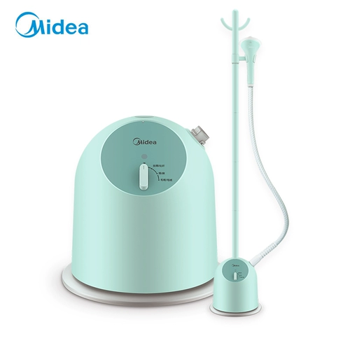 Мидиагический период домохозяйства маленький висящий пароход железо, гладило одежду, держащую гладильную машину держатель