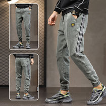 Drawstring elastic waist pants mens spring and autumn Korean version of the trend loose leg shrink three bars fashion pants