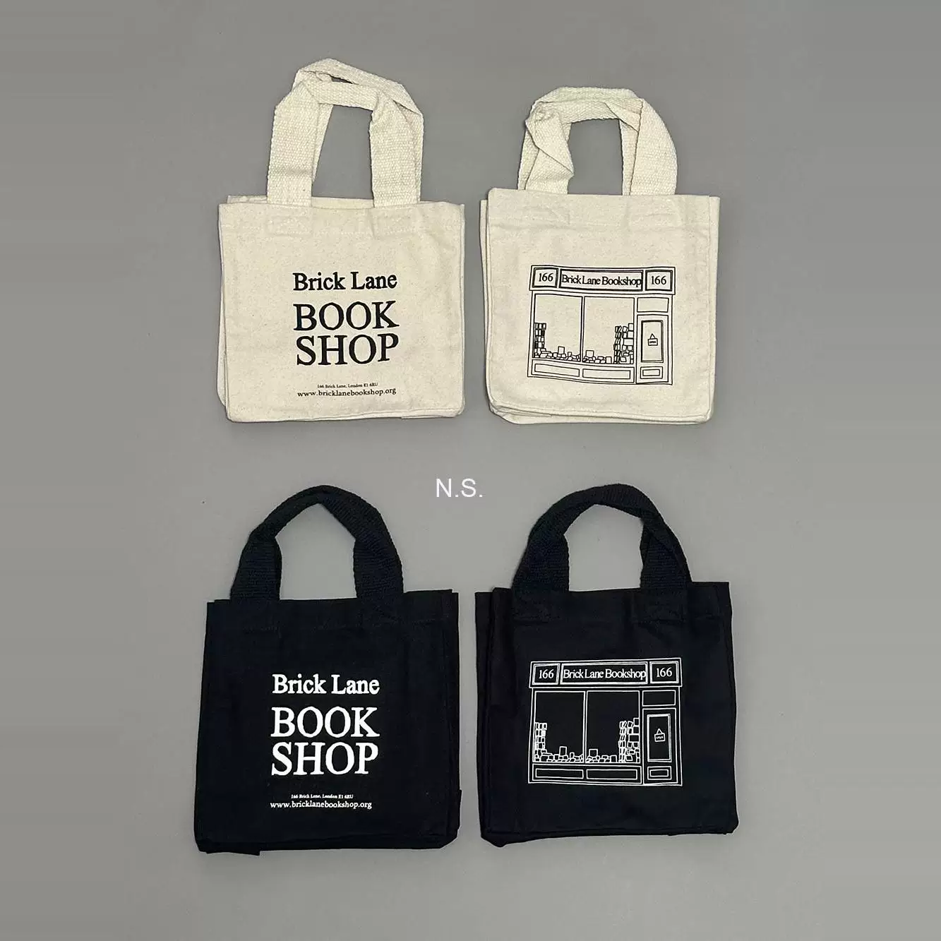 Подлинные товары на складе, BrickLane Bookstore, Восточный Лондон, UK, холщовые сумки окружения, сумки через плечо