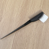 Большая черная расческа