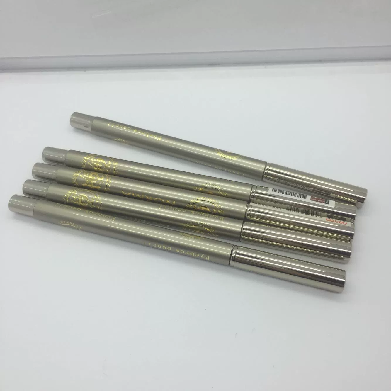 Năm miễn phí vận chuyển Norma Norma ống đồng ống vàng bút chì kẻ mày kéo dài không lem màu nâu cà phê đen - Bút chì lông mày / Bột / Stick