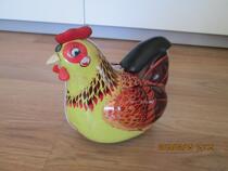 Nostalgic old tin hen laying egg toy