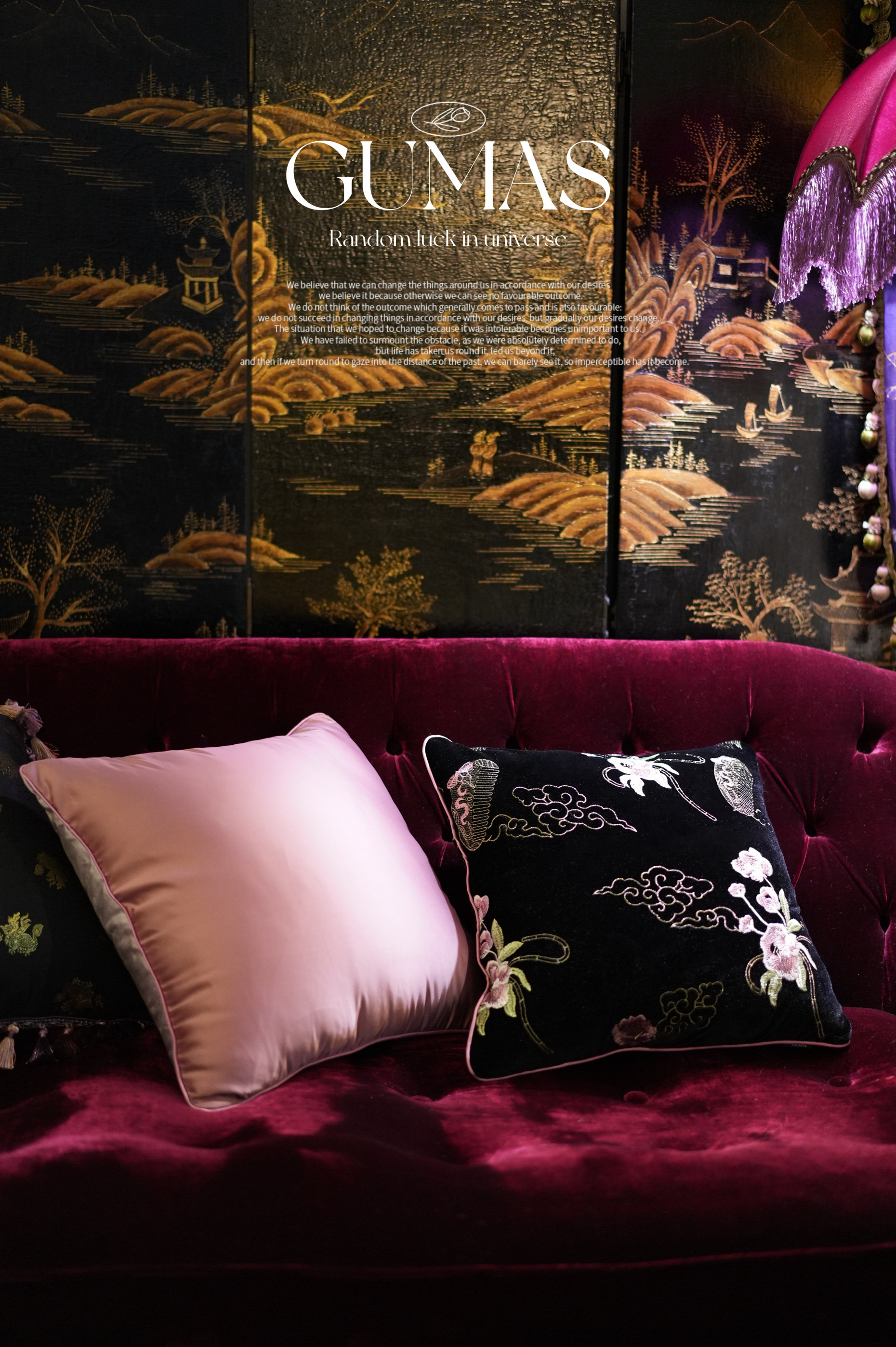 Oriental-inspired velvet pillow set with embroidered cloud scrollwork and floral motifs in burgundy living room