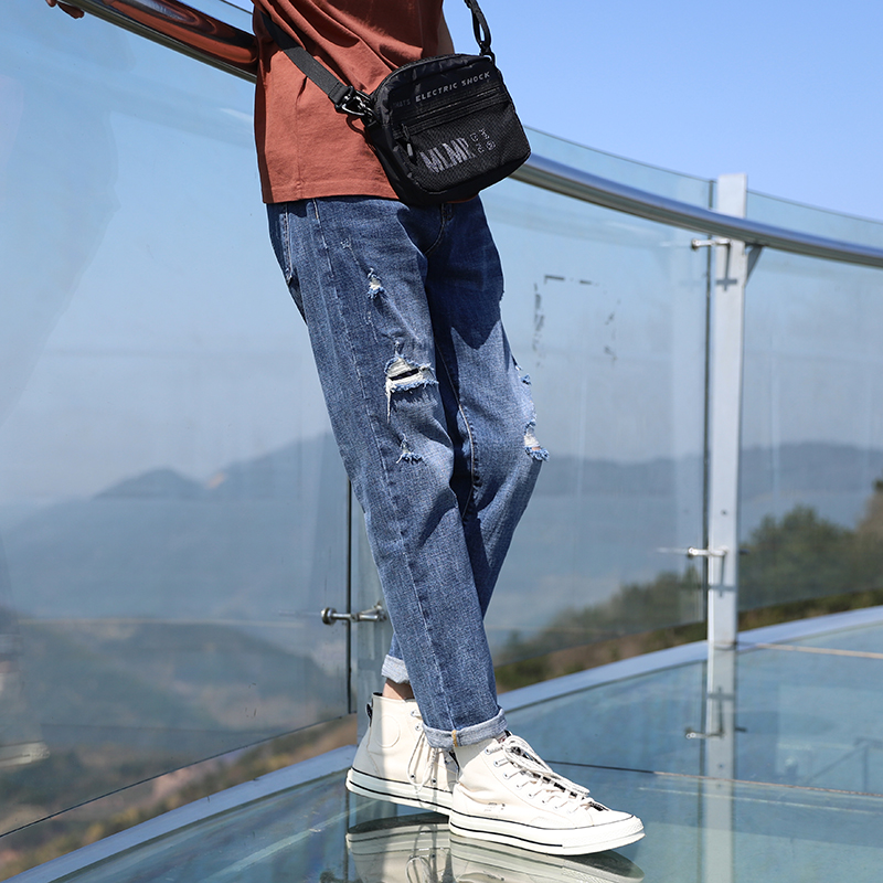 Ripped jeans men's trousers slim-fit small feet Japanese spring and summer new youth Korean version of the trend Harun elastic personality