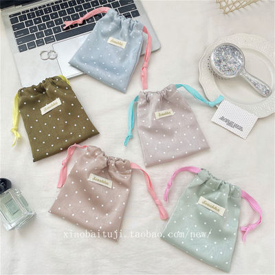 The Little White Rabbit multi-dot satin drawstring bag has a fine drape texture and is a dust-proof storage bag for small travel items