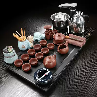 The whole piece of natural black gold stone tea tray Household tea sea automatic four-in-one simple living room tea table Kung Fu tea set