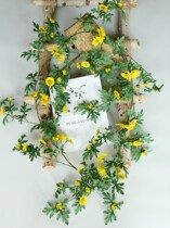 Simulation of sunflower flowers and vines fake flowers rattan daisies air conditioning pipes winding indoor background wall window decoration shielding