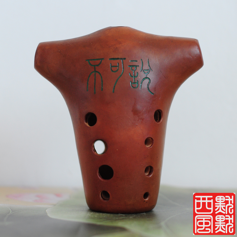 Yin's Tao-Hoon Intermediate playing with a ten-hole bull head and a murky West Wind Music bungalow