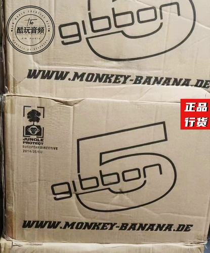 Обезьяна банана/банановой обезьяны Gibbon 5/8 возле поля с динамиками для прослушивания источника [Cool Audio]