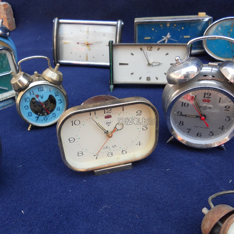 Old-fashioned small alarm clock nostalgic old objects used mechanical clockwork watch 7080 90 s antique antique collection