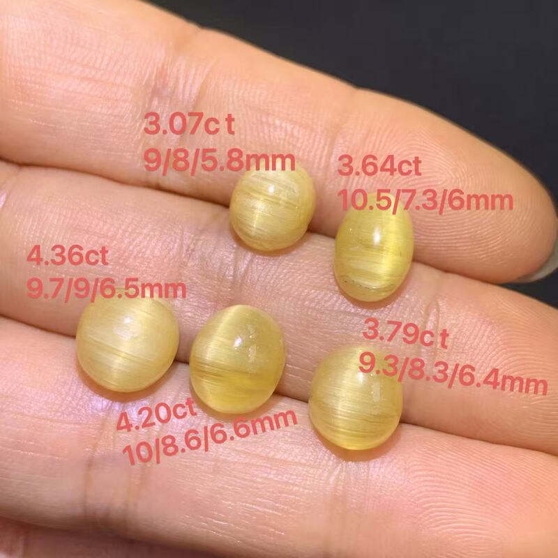 Approximately 3.76 Carats, Natural Yellow Sea Aquamarine Cat's Eye Loose Stone, Ring Face, Egg-Shaped, Specification 10*9*5.2mm Approximately 3.76 Carats, Natural Yellow Sea Aquamarine Cat's Eye Loose Stone, Ring Face, Egg-Shaped, Specification 10*9*5.2mm