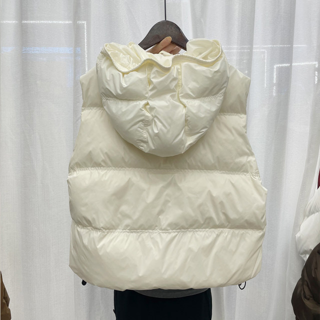 ເສື້ອກັນໜາວແບບເກົາຫຼີ hooded down vest ຂອງແມ່ຍິງນອກສັ້ນ 2023 ລະດູຫນາວໃຫມ່ thickened vest ວ່າງລົງ jacket vest