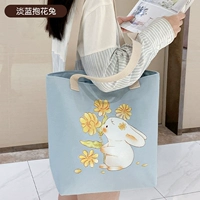 Светло -голубой держит кролика