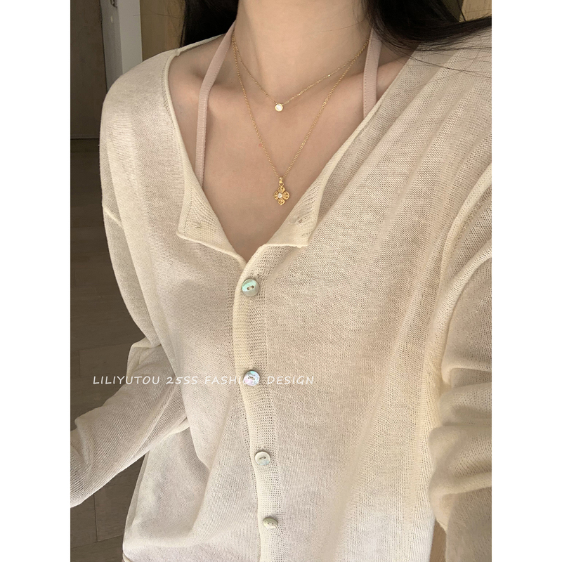 Lili Taro Pearl Shell Kiss Is a Versatile and Stylish Cream-Colored, Lazy-Style Sheer Knit Cardigan That Goes with Everything