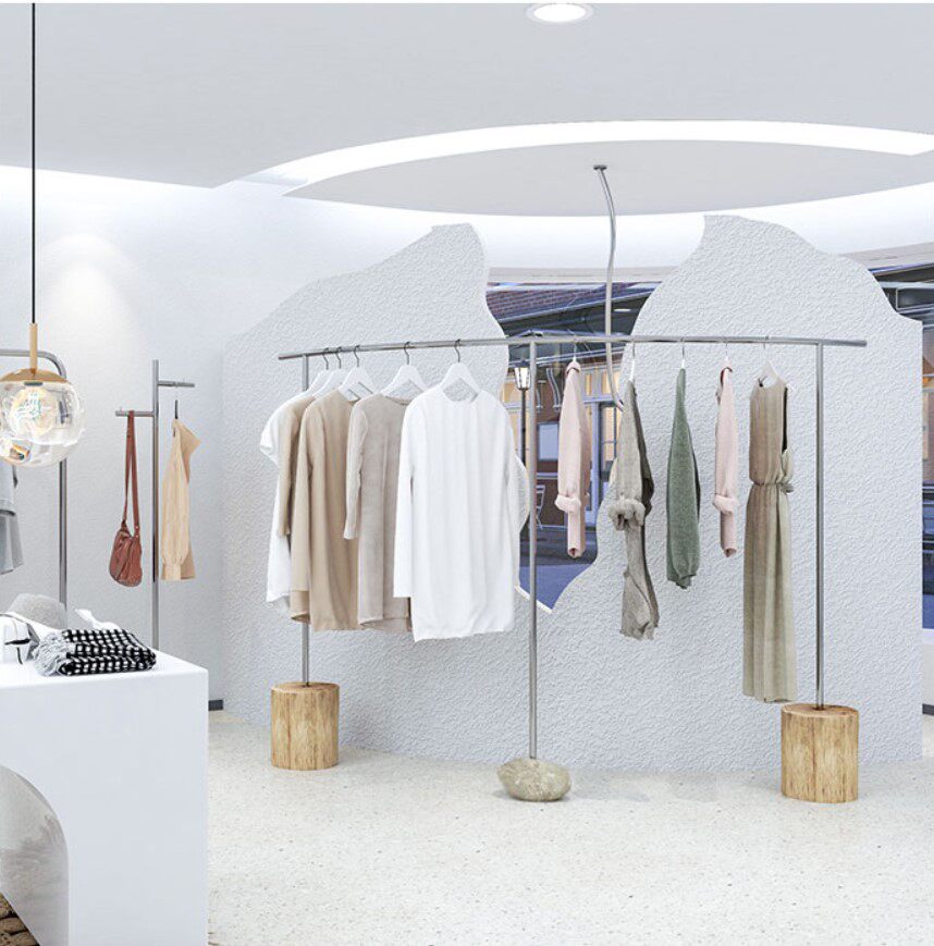 New semi-arc with stone wood stainless steel clothing display garment store in the island floor-to-ground hanger rack