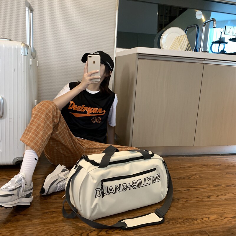 Travel bag girl short-distance light capacity, small skinny bag male tide travel handcuff tour bag