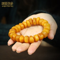 A picture of a piece of Tibetan natural original mine old beeswax hand string mens Tibetan hand-held Buddha beads female play Amber bracelet