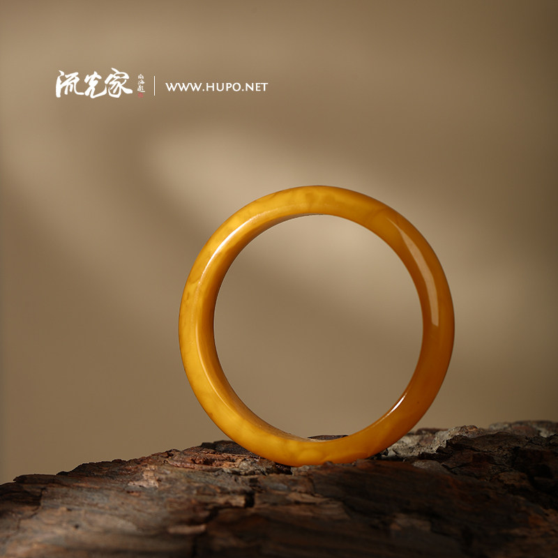 The Streamer Collection of the small year old nectar wax bracelet attached to the NGTC national inspection certificate