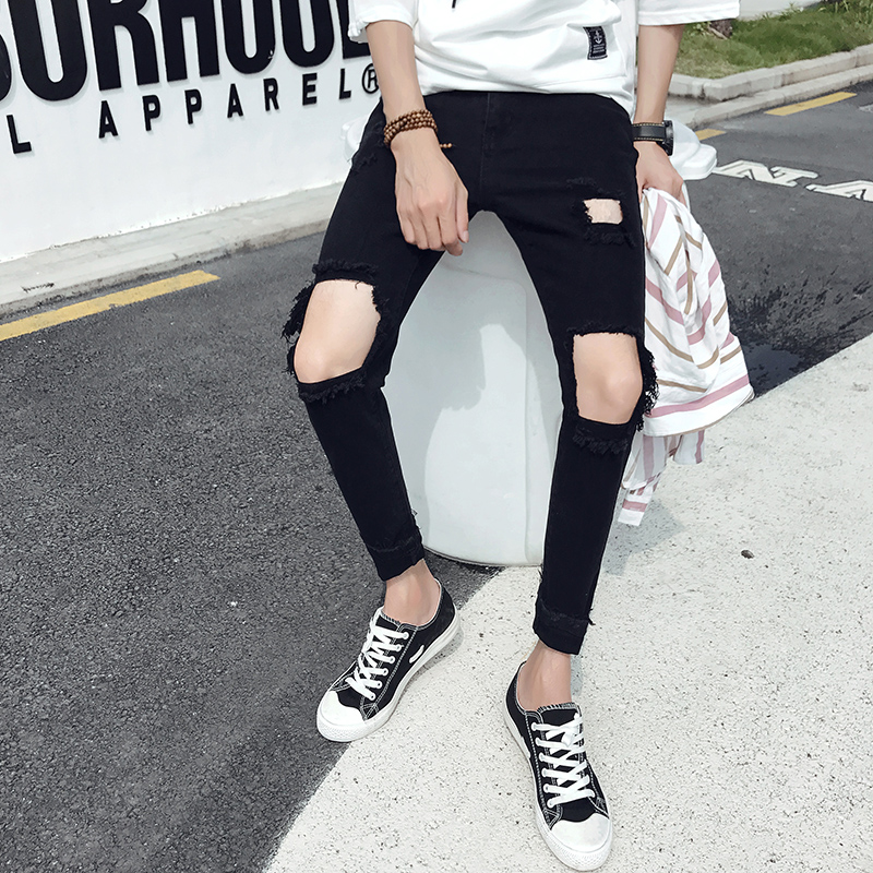 black jeans with big knee holes