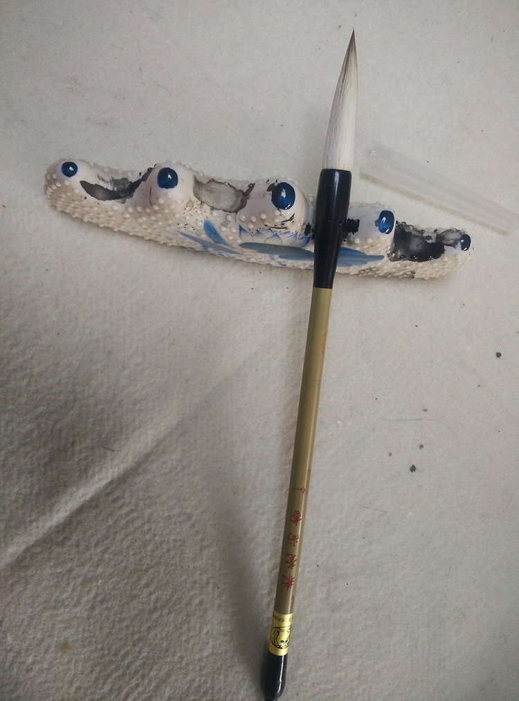 Faculhanshu (I) and a calligraphy brush with a calligraphy brush dedicated to the Chinese painting The Lakers of the Sheep Wolf