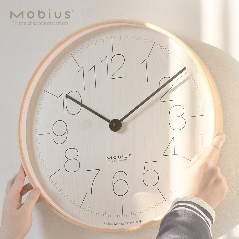 mobius Nordic light luxury wooden simple creative wall clock Fashion personality silent clock Living room ins large hanging watch