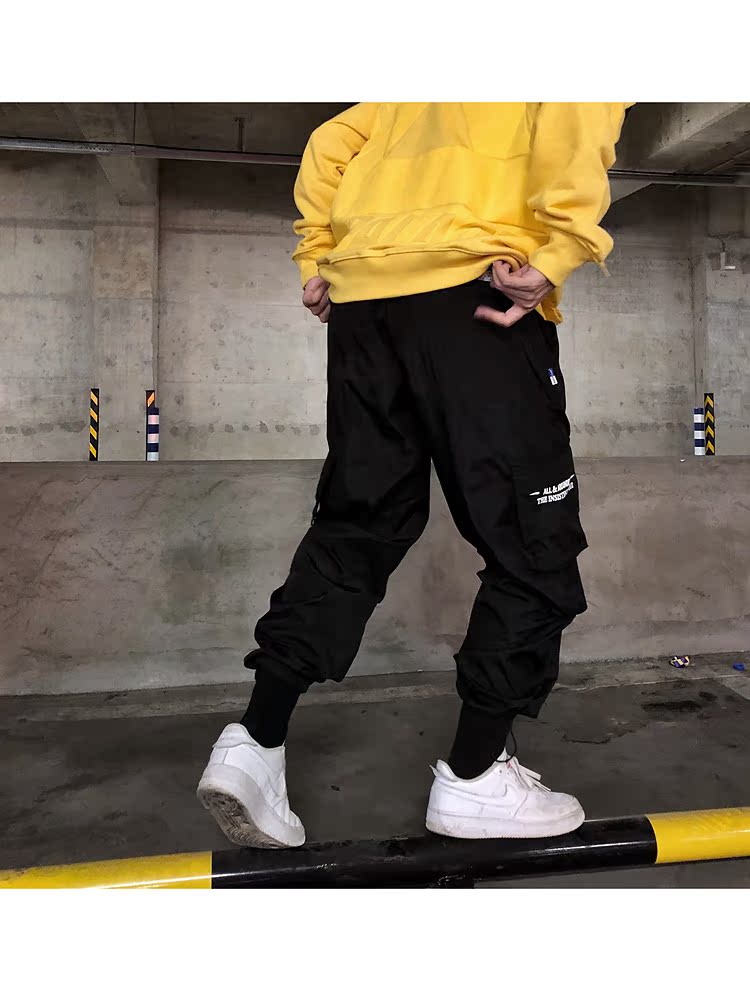 Hip hop hiphop quần lỏng lẻo nhiều túi dụng cụ quần rộng chân thủy triều thương hiệu nam và nữ lỏng lẻo mồ hôi chức năng shop quần áo nam