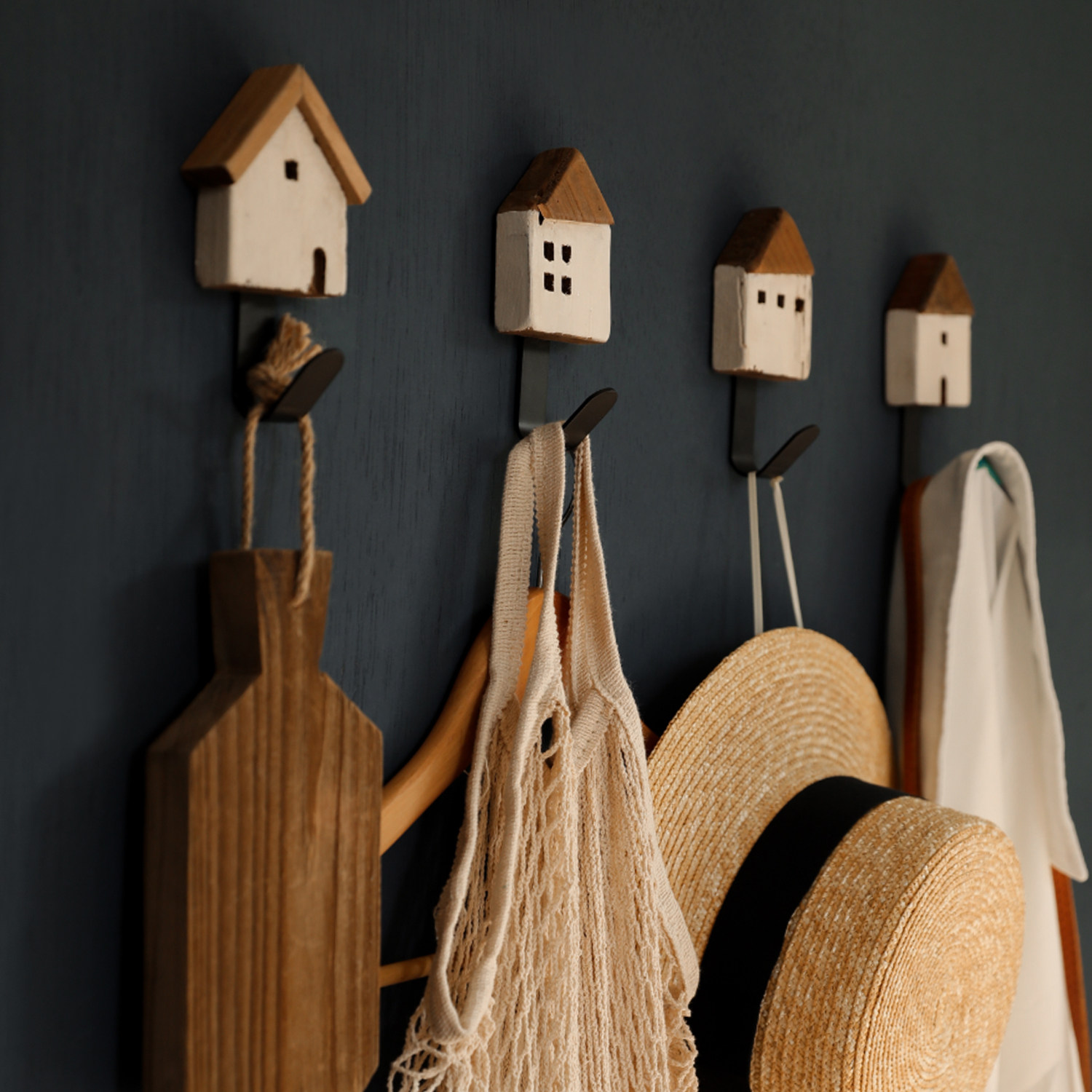 Xi has -- solid wood retro creative door swing piece clothing and hat rack folk dormitory wall four pieces of hook sale on the wall