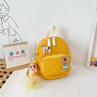 Маленькая желтая кукла