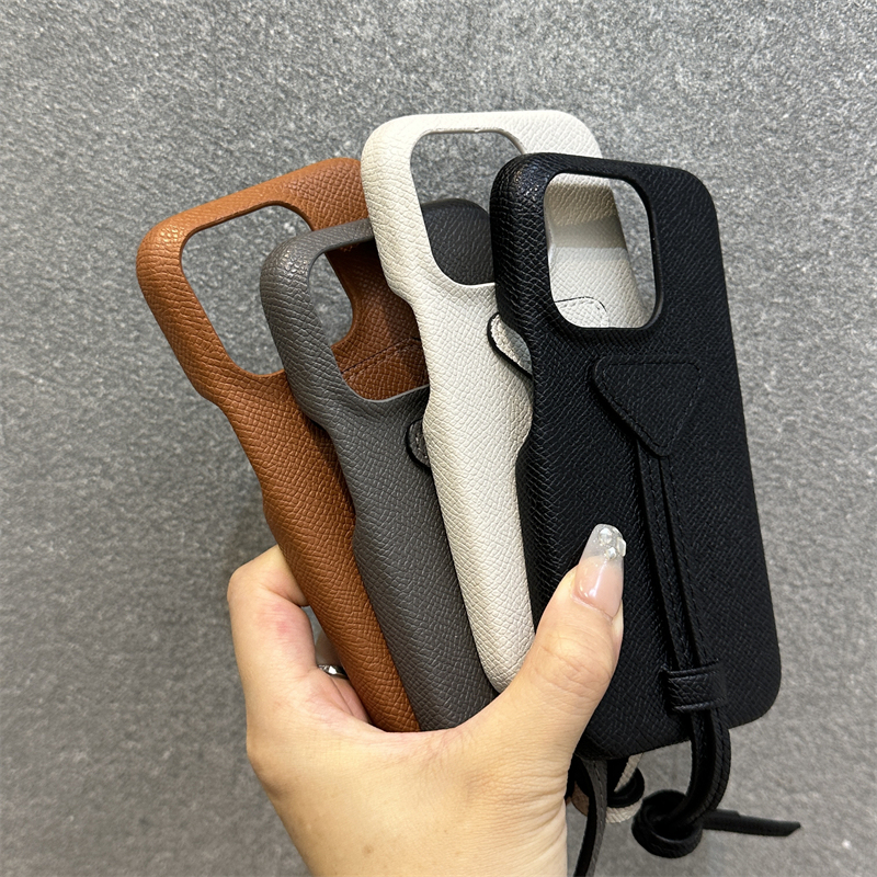 New European and American Trendy Brand Iphone16Promax Phone Case iPhone 14 Lychee Leather Texture 13 Trendy Brand 15 Suitable for Ip12 Protective Case Triangle Brand Ip17 with Wrist Strap Phone Case New European and American Trendy Brand Iphone16Promax Phone Case iPhone 14 Lychee Leather Texture 13 Trendy Brand 15 Suitable for Ip12 Protective Case Triangle Brand Ip17 with Wrist Strap Phone Case