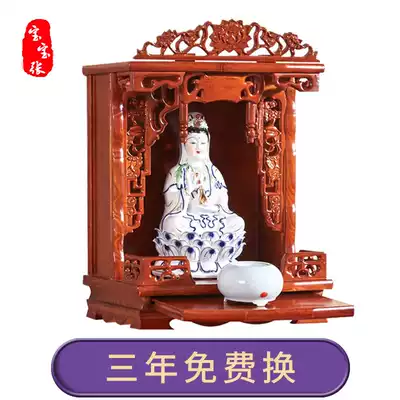 Buddha statues enshrine small wall-mounted shrines