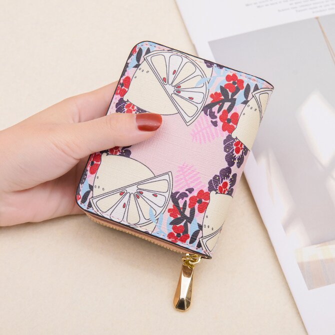 Short clip female student small crowddesign cute Japan-ROK version genuine leather fashion card bag zero wallet integrated black hole