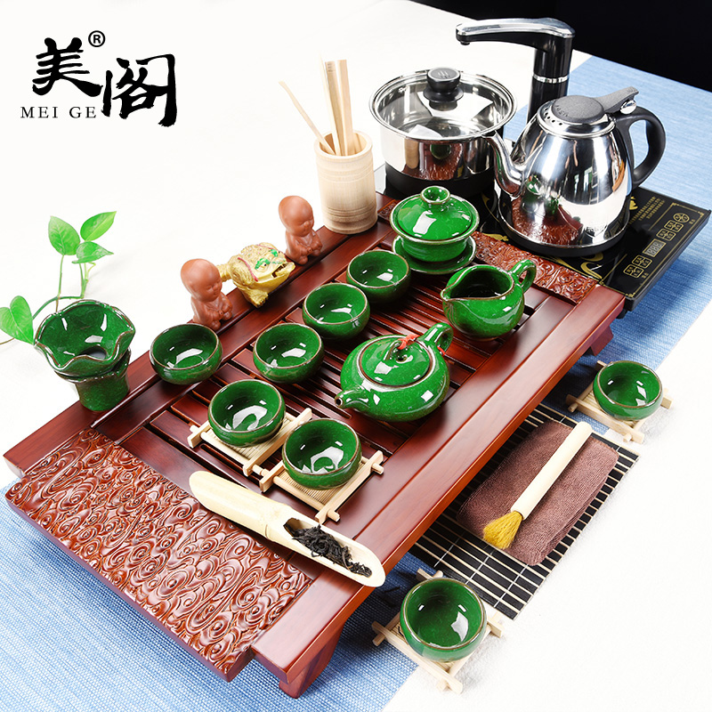 The cabinet of a complete set of ceramic tea set household contracted and I kung fu tea tray was four unity electrothermal furnace tea cups