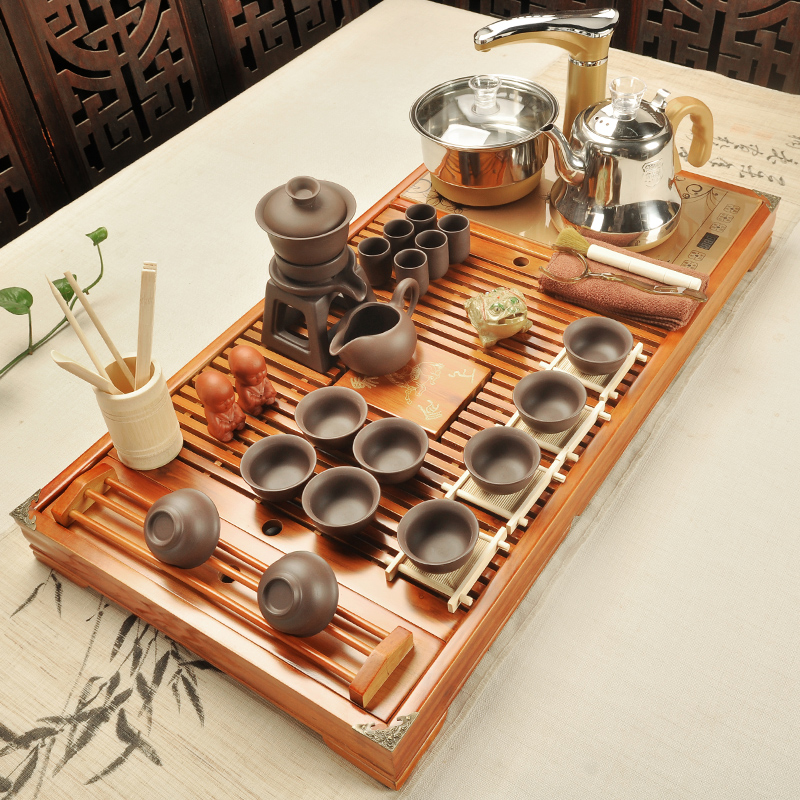The cabinet of household ceramic teapot kung fu tea set solid wood tea tray tea tea table automatic electric magnetic furnace