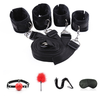 Bed with handcuffs splash flap tied to stick blindfolds binding five pieces of fun items